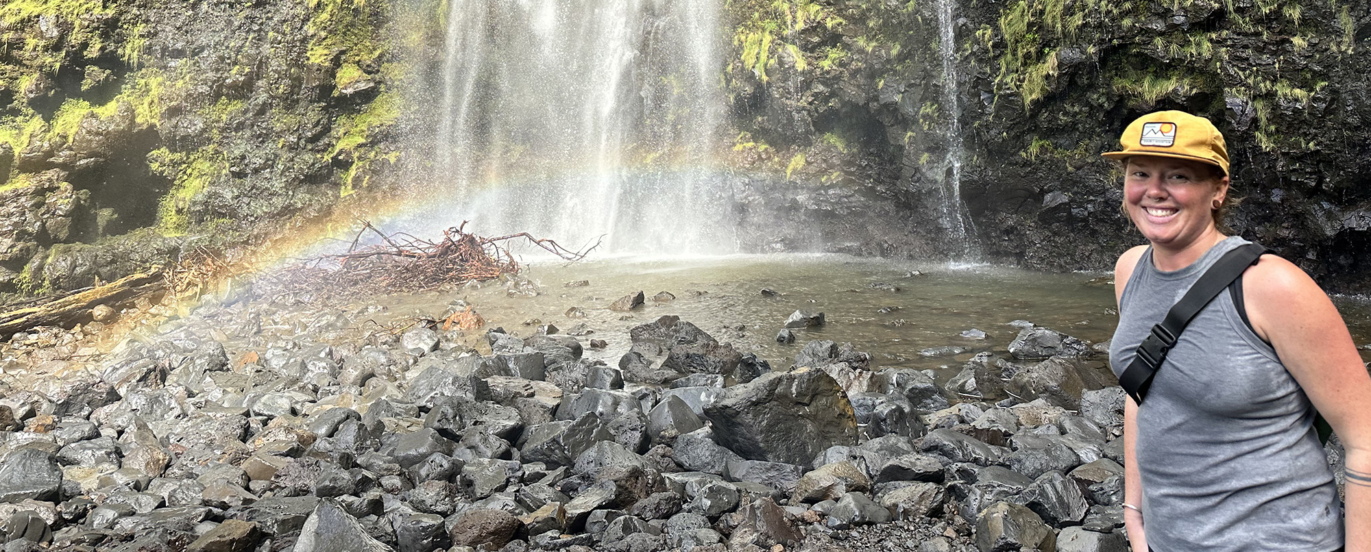 Whitney Harrington in front of a waterfall