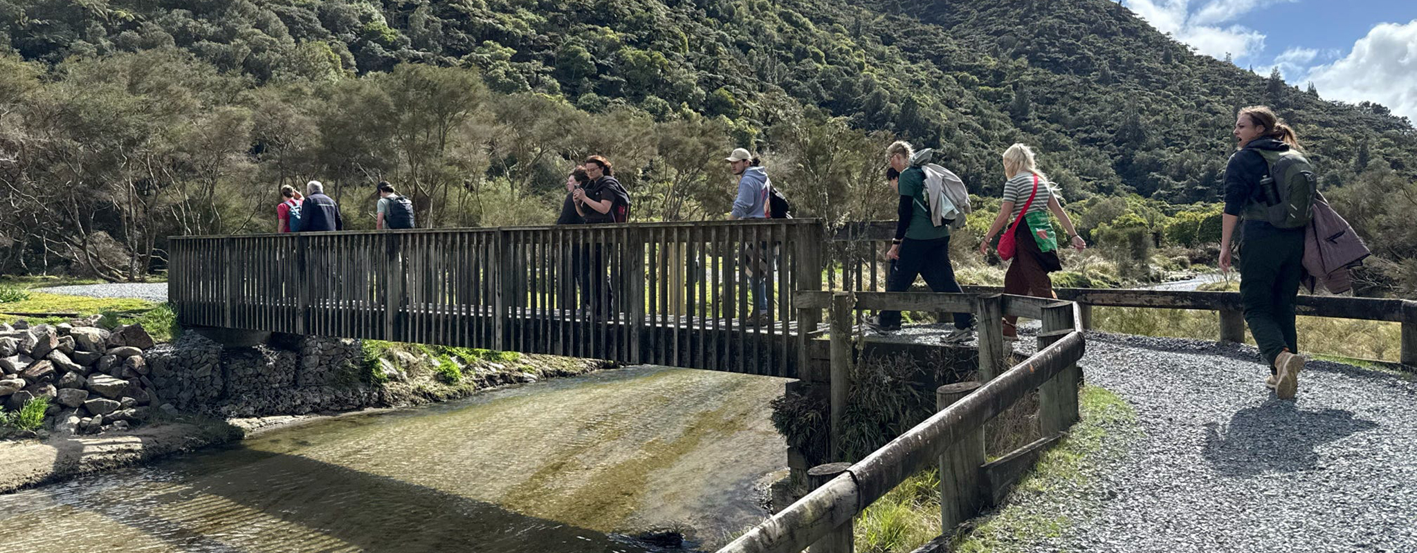 students on the New Zealand trip cross a bridge