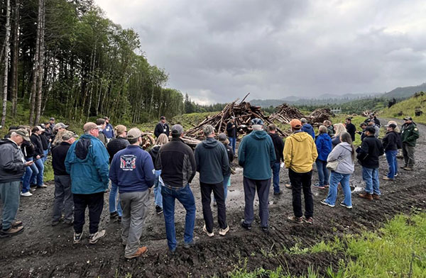 At the PH Timber, LLC-Broken Gate fire site, presenters explained the consequences of a human-caused wildfire, the risks posed by unburned slash piles and the work involved in salvage harvesting and replanting. 