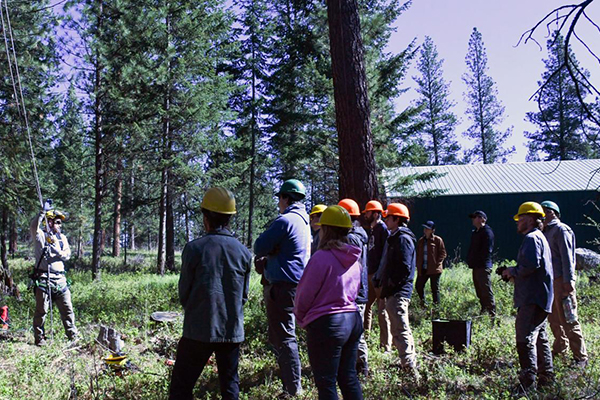 Micah Schmidt, OSU Extension fire specialist for the northeast region, provides tree-climbing instruction to the Northwest Youth Corps’ Community Wildfire Protection Corps crew at the OSU Oberteuffer Research and Education Forest in Union County.