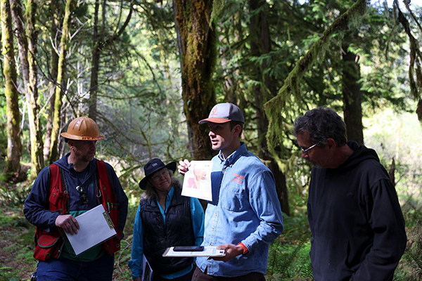 OSU Extension forester Jake Barker shows a map of the site on a stop during the Climate-Informed Forestry Tour, held in April at OSU’s Matteson Demonstration Forest in Gaston.