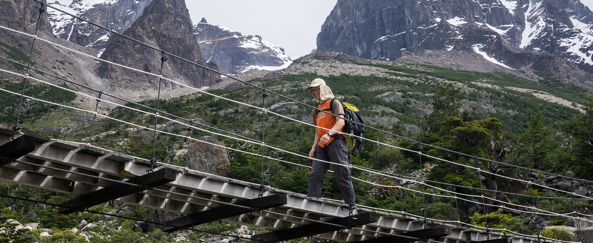 Zach Leslie walks across a bridge in New Zealand.