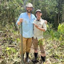 Andrew Birrell with collegue in forest in Borneo