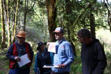 OSU Extension forester Jake Barker shows a map of the site on a stop during the Climate-Informed Forestry Tour, held in April at OSU’s Matteson Demonstration Forest in Gaston.