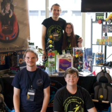 The members of PNW Assistive Technology in front of their table at InventOR.
